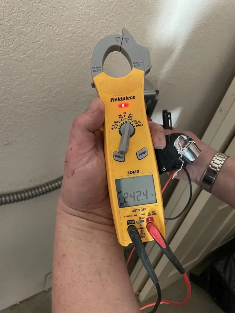 Voltage testing with clamp meter during Electrical Installation Services in Robertsdale